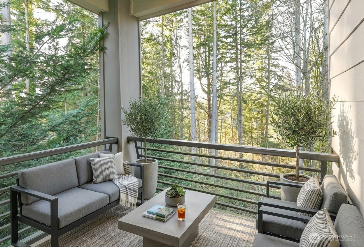 13724 Ash Way, Unit C1 Everett, WA 98204 - Photo 29 of 36 a balcony with wooden floor and outdoor seating