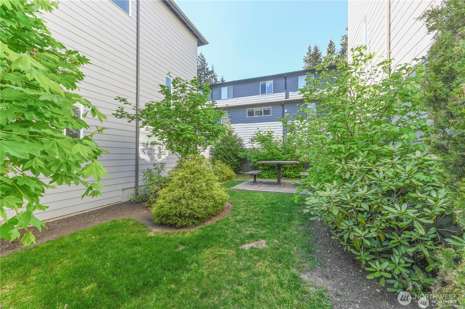 13724 Ash Way, Unit C1 Everett, WA 98204 - Photo 35 of 36 a view of a house with a yard and plants