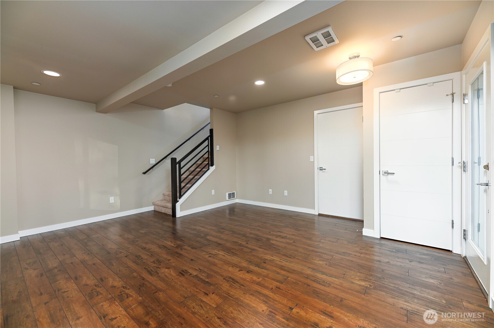 13724 Ash Way, Unit C1 Everett, WA 98204 - Photo 7 of 36 a view of an empty room with wooden floor