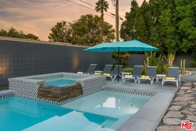 a view of a patio with chairs and tables