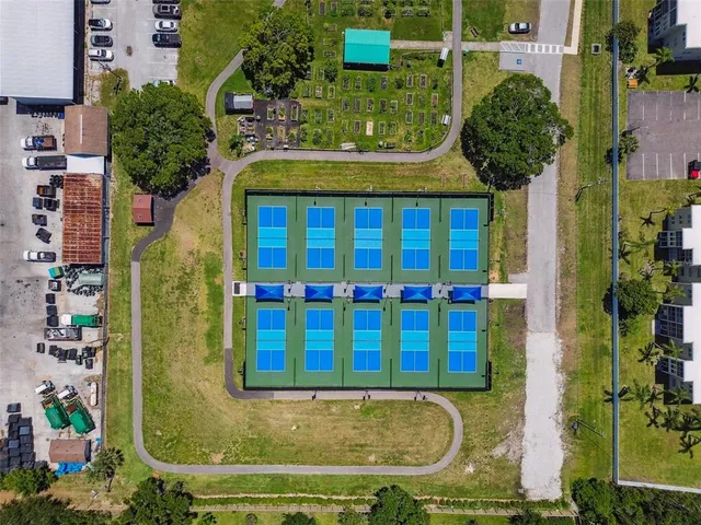 a bathroom with a granite countertop sink mirror and shower