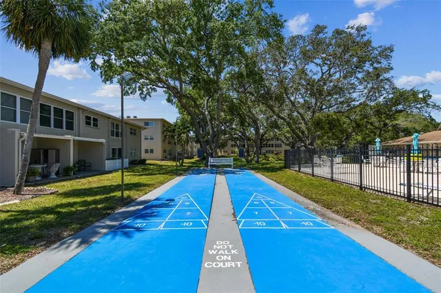 a living room with furniture a rug and a chandelier