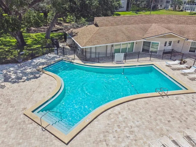 a view of a house with a backyard patio and sitting area