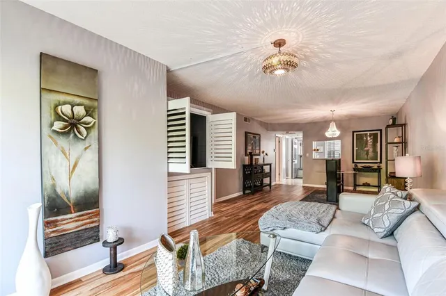 a en suite bathroom with a granite countertop double vanity sink and a mirror