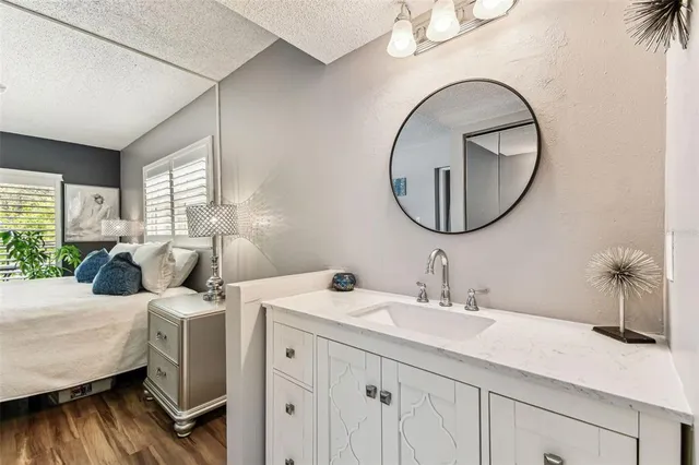 an aerial view of residential houses with outdoor space and swimming pool