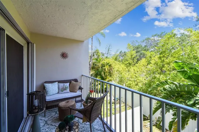 a view of swimming pool with seating area and barbeque oven