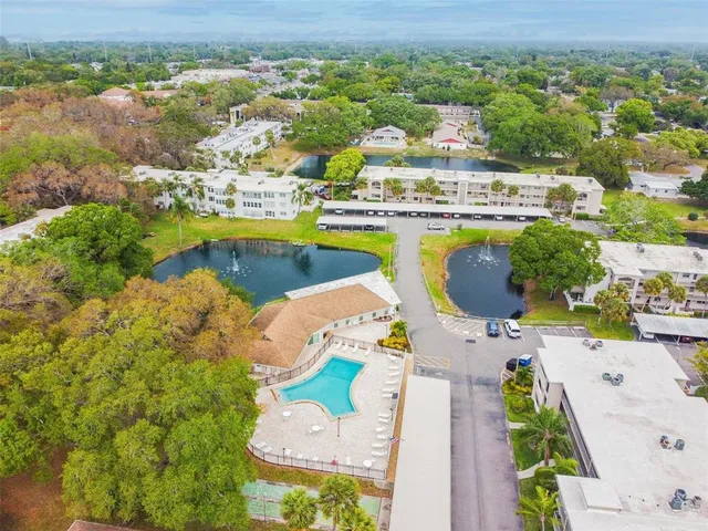 a view of a dining area with furniture and a large window