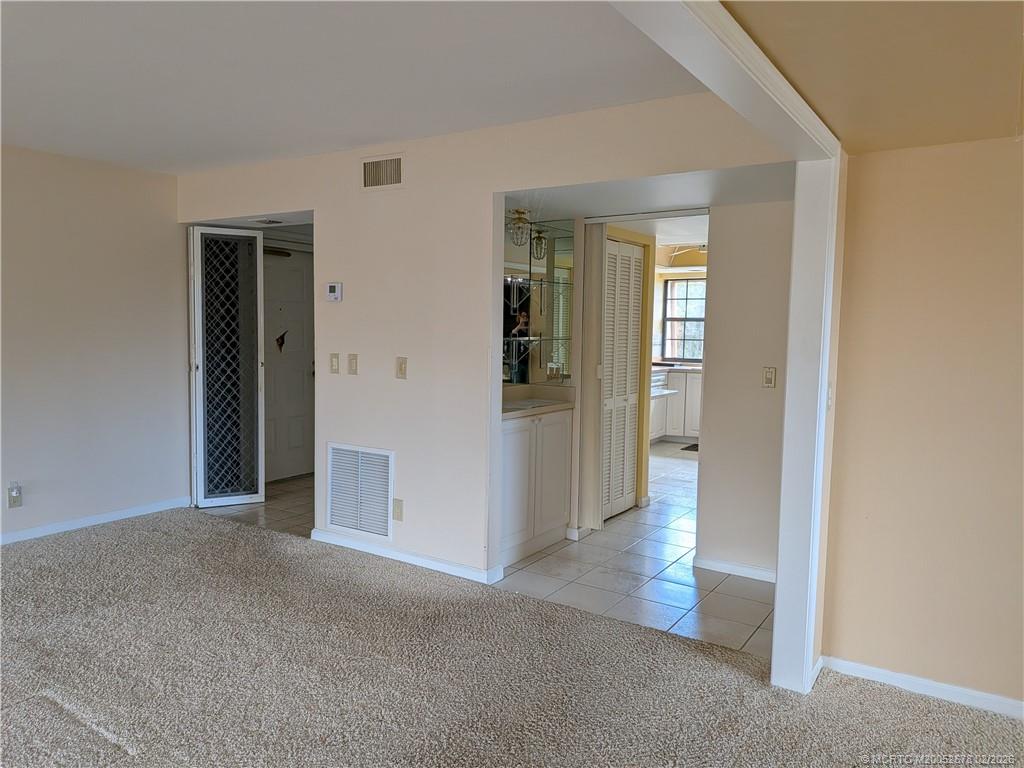 3100 Southeast Pruitt Road, Unit B301 Port St. Lucie, FL 34952 - Photo 17 of 40 Entry to Bar. Kitchen beyond. Flex to right