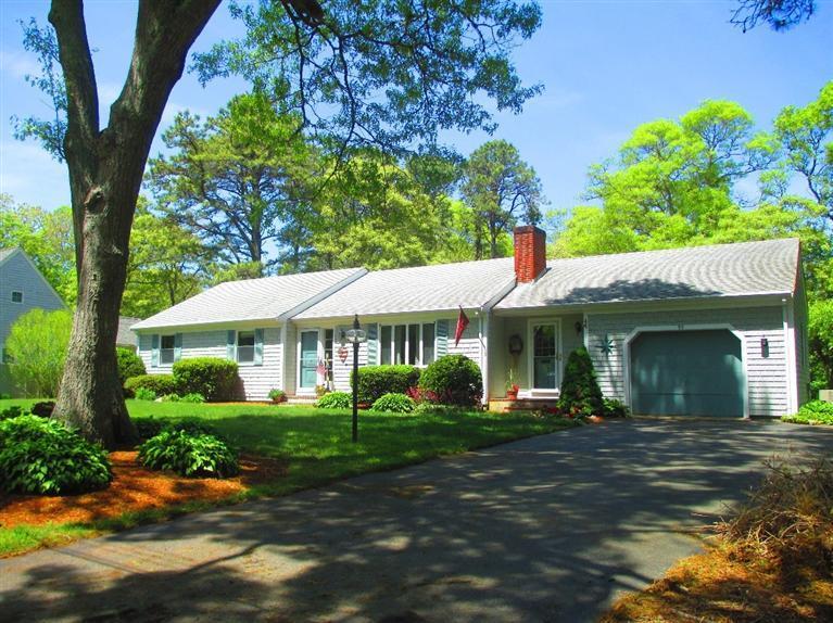 52 Thread Needle Lane Centerville, MA 02632 - Photo 1 of 32 front view of a house with a yard