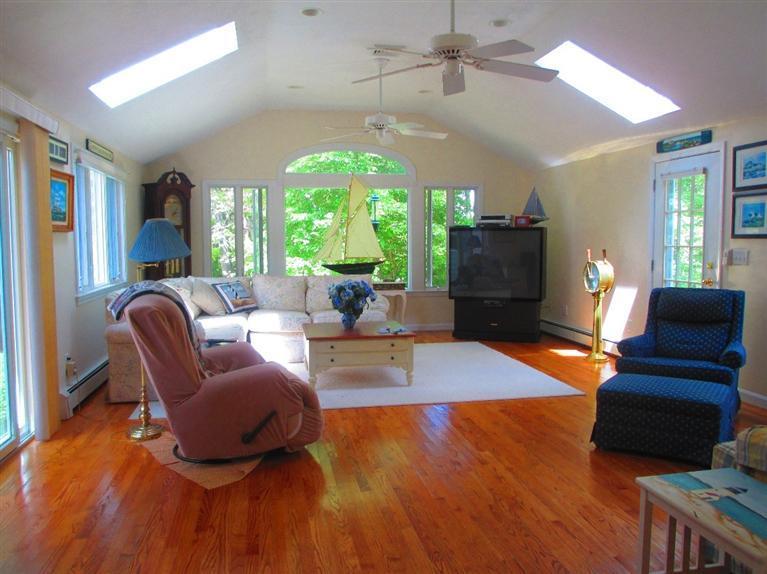 52 Thread Needle Lane Centerville, MA 02632 - Photo 11 of 32 a living room with furniture and a large window