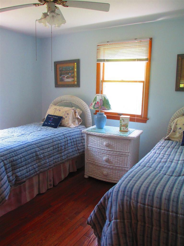 52 Thread Needle Lane Centerville, MA 02632 - Photo 13 of 32 a bedroom with a bed and a window