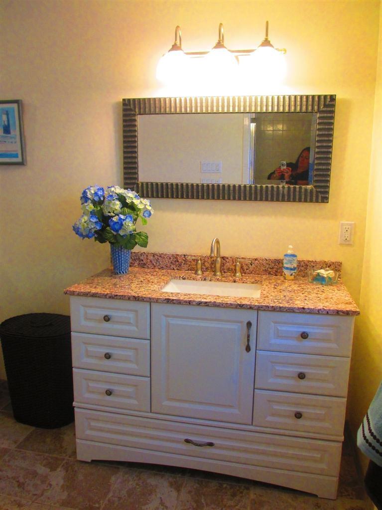 52 Thread Needle Lane Centerville, MA 02632 - Photo 16 of 32 a bathroom with a sink and a mirror