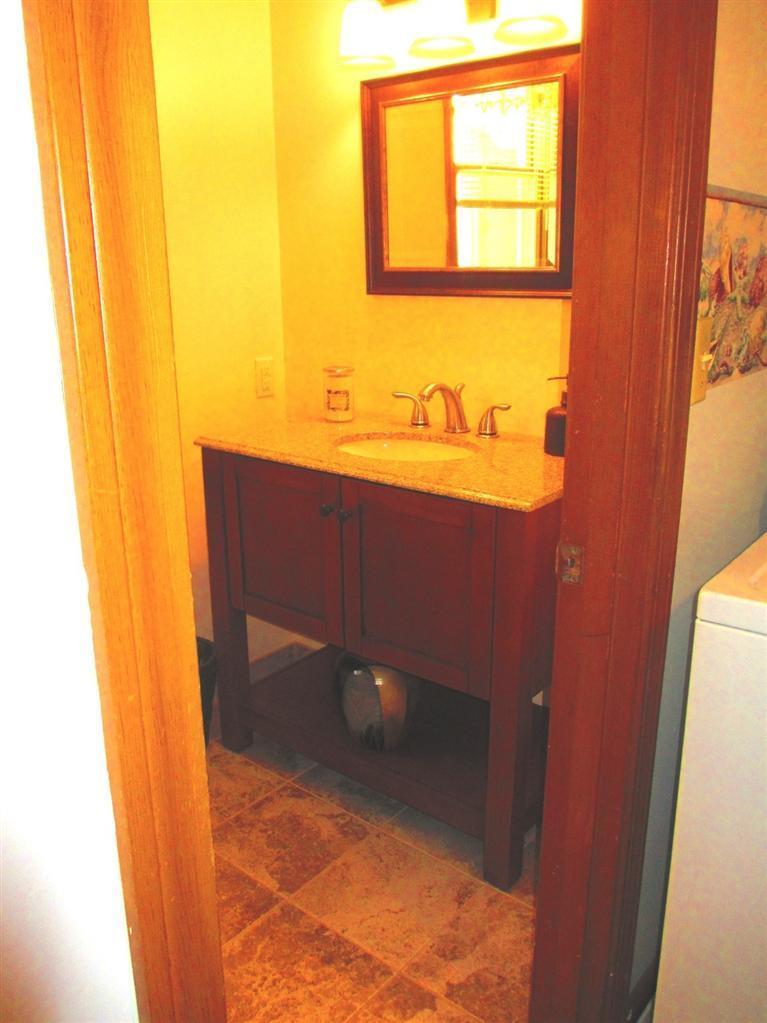 52 Thread Needle Lane Centerville, MA 02632 - Photo 18 of 32 a bathroom with a sink and a window