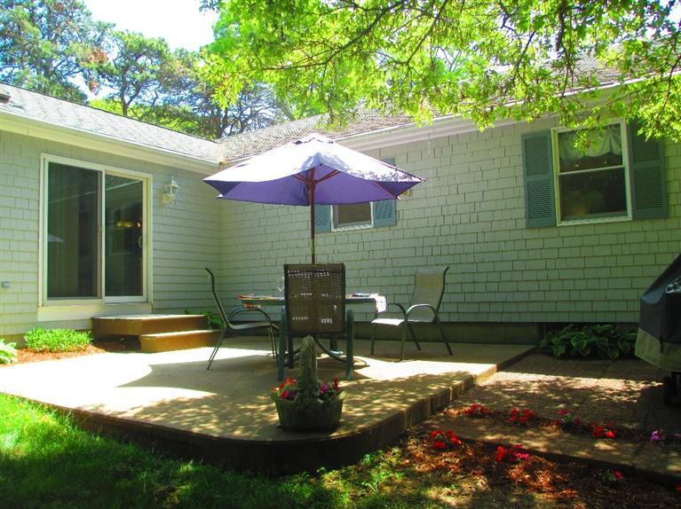 52 Thread Needle Lane Centerville, MA 02632 - Photo 23 of 32 a swimming pool with outdoor seating yard