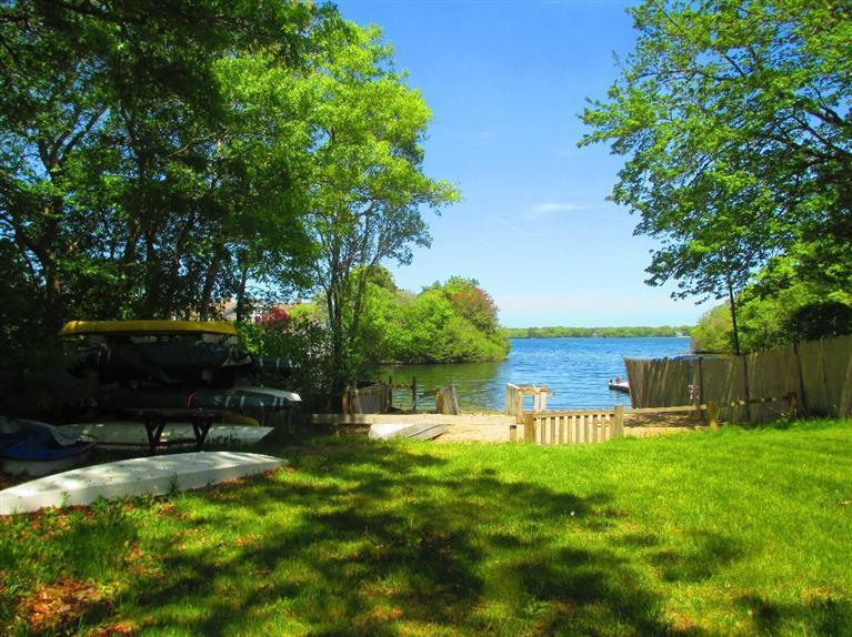 52 Thread Needle Lane Centerville, MA 02632 - Photo 26 of 32 a view of a backyard with a garden