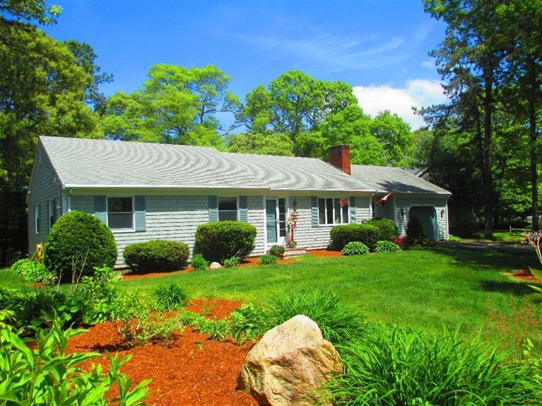 52 Thread Needle Lane Centerville, MA 02632 - Photo 3 of 32 a view of a house with a yard and potted plants