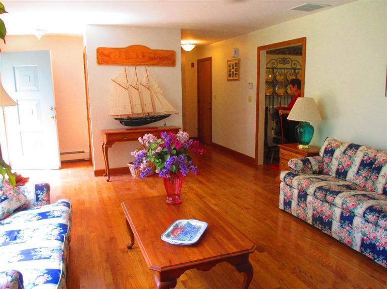 52 Thread Needle Lane Centerville, MA 02632 - Photo 5 of 32 a living room with furniture and wooden floor