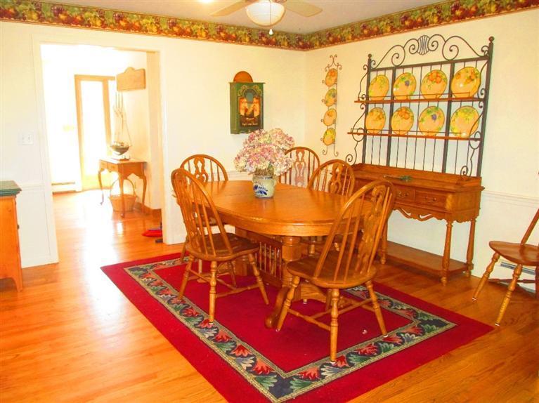 52 Thread Needle Lane Centerville, MA 02632 - Photo 6 of 32 a view of a dining room with furniture and a table