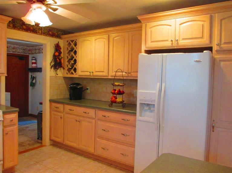 52 Thread Needle Lane Centerville, MA 02632 - Photo 8 of 32 a kitchen with stainless steel appliances a refrigerator and cabinets