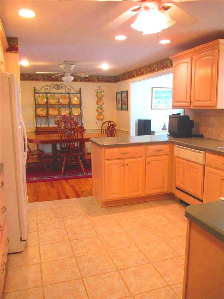 52 Thread Needle Lane Centerville, MA 02632 - Photo 10 of 32 a large kitchen with stainless steel appliances granite countertop a sink and cabinets