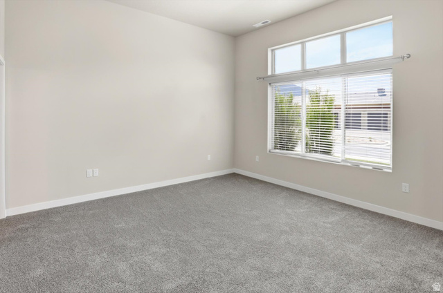 1838 West 300th Street South, Unit B Mapleton, UT 84664 - Photo 20 of 51 Spacious room featuring vaulted ceilings, light gray wall paint, and gray carpeting