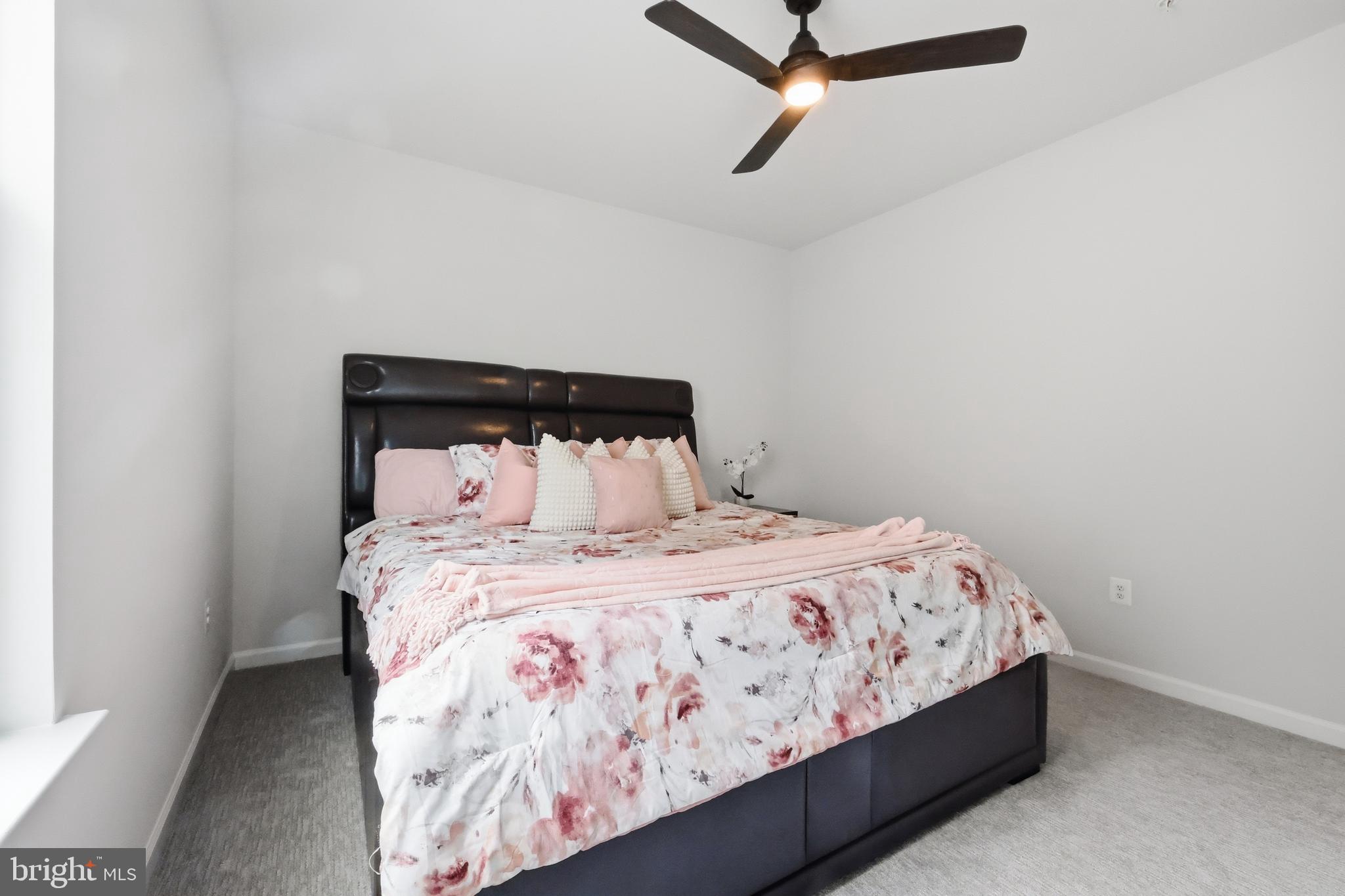5707 Hawk Ridge Road Frederick, MD 21704 - Photo 49 of 109 a bed sitting in a bedroom next to a window