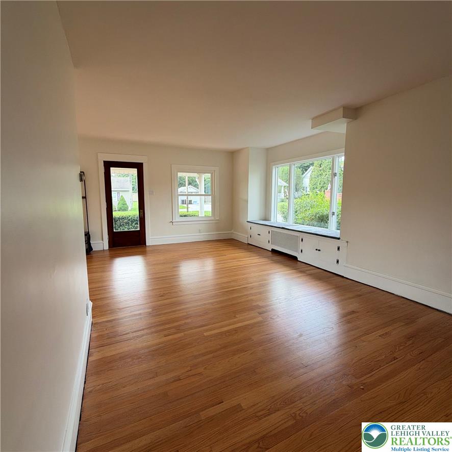 5111 Vera Cruz Road Emmaus, PA 18049 - Photo 11 of 44 Gleaming hardwood floors and a built-in window seat define this airy living space.