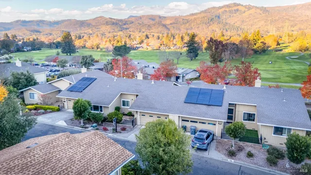 an aerial view of house with yard swimming pool and outdoor seating