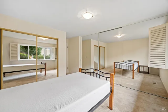 a living room with furniture and large window