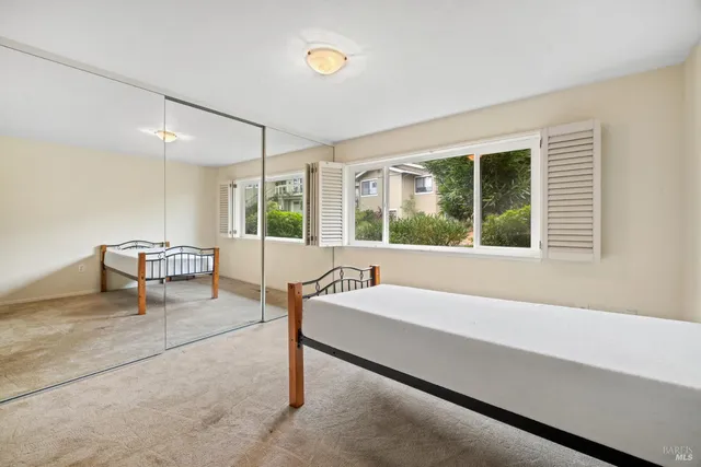 a bathroom with a granite countertop sink a shower and a mirror