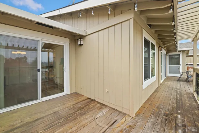 a view of a balcony with table and chairs