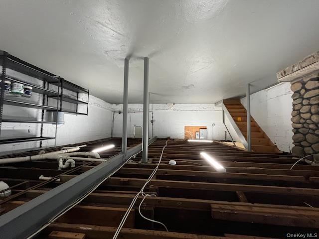 46 Firwood Road, Unit 1 Port Washington, NY 11050 - Photo 15 of 16 Unfinished basement featuring stairs