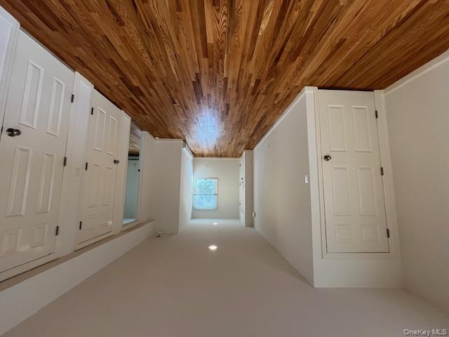 46 Firwood Road, Unit 1 Port Washington, NY 11050 - Photo 3 of 16 Corridor with dark wood finished floors and recessed lighting