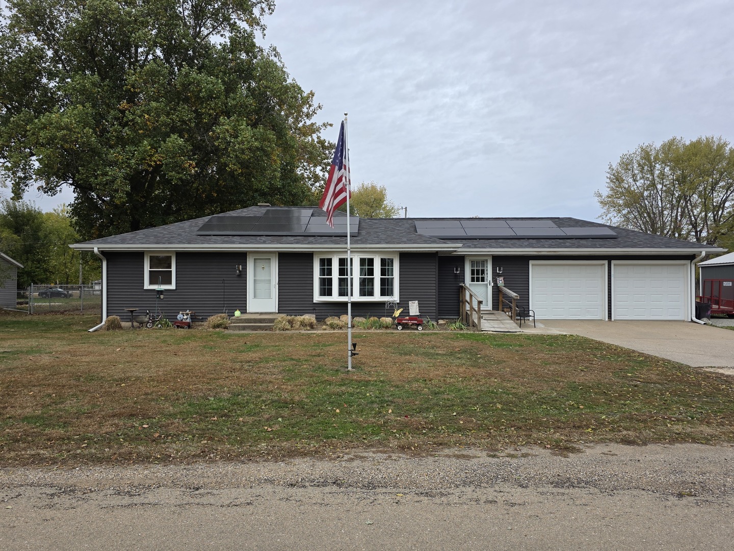 603 1st Street West Lyndon, IL 61261 - Photo 1 of 22 a front view of a house with a yard and garage