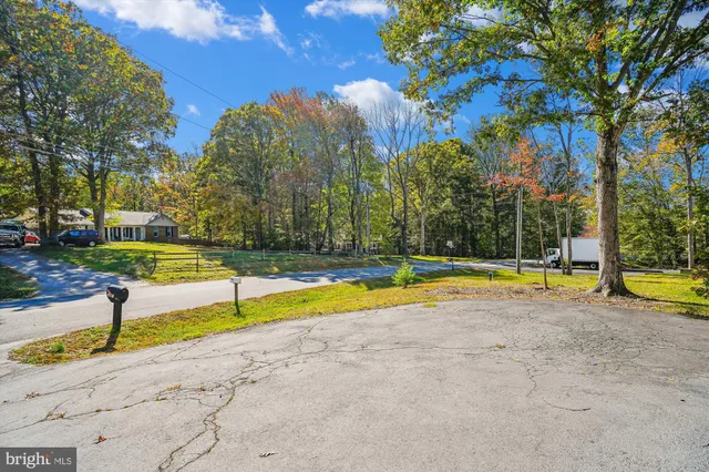 a view of swimming pool with sitting area and garden