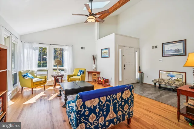 a bedroom with furniture and a wooden floor