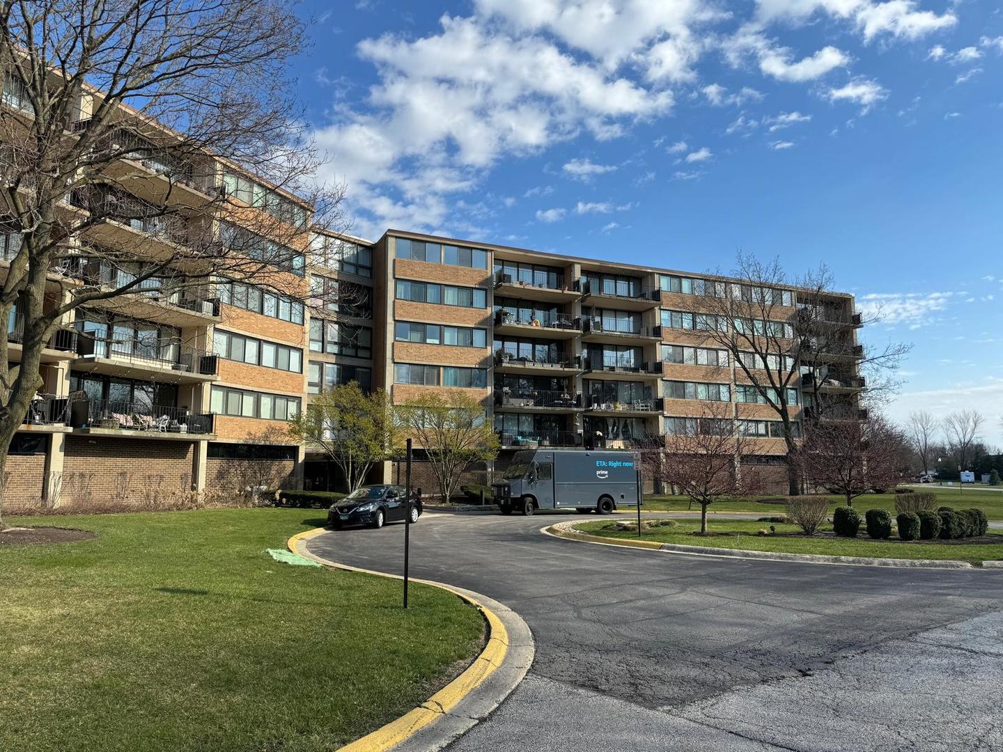 a view of a building with a backyard
