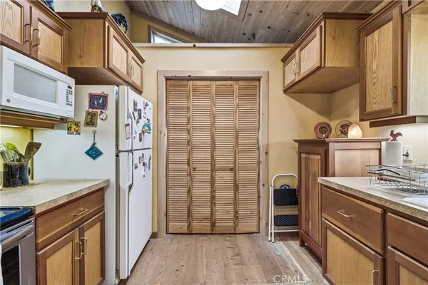 a bathroom with a granite countertop sink and a window