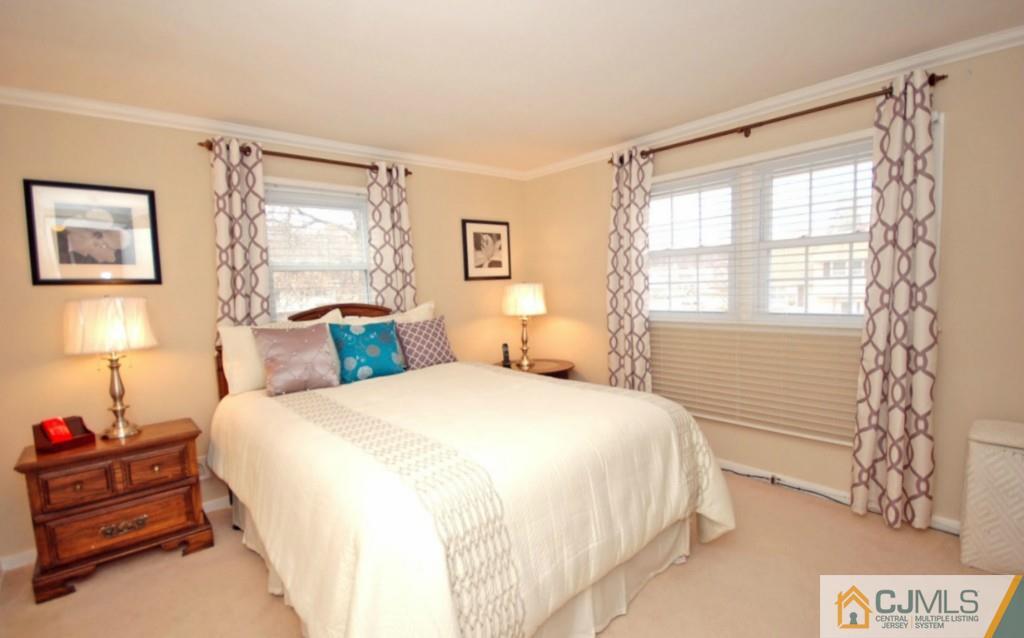 2 June Middlesex, NJ 08846 - Photo 14 of 23 a spacious bedroom with a bed and a window