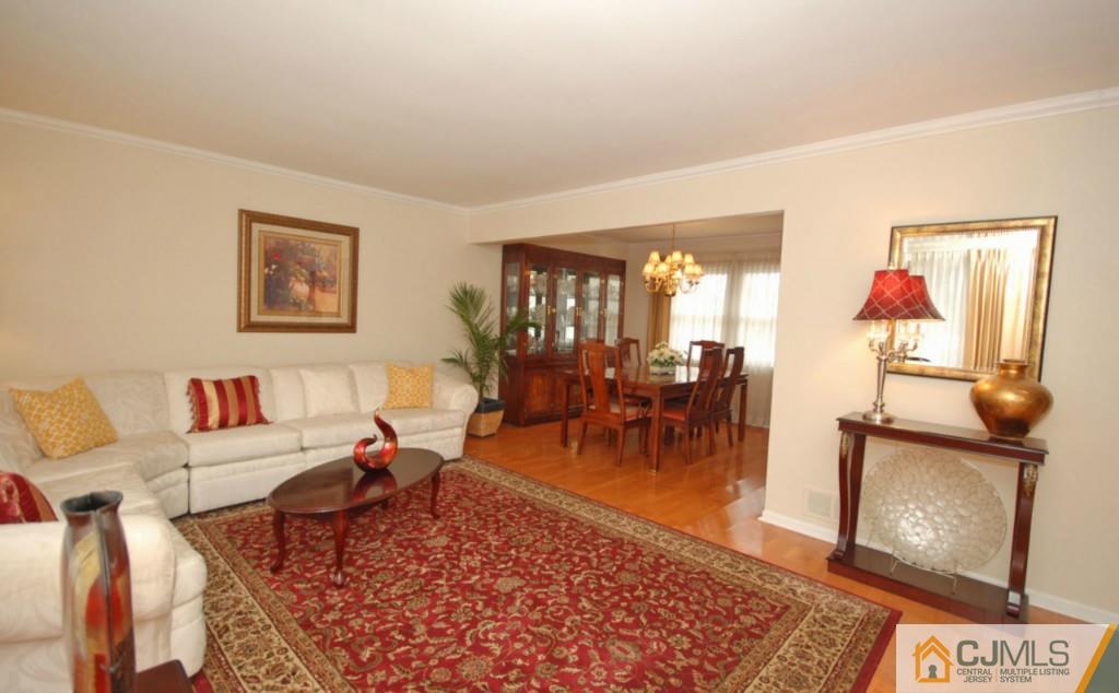 2 June Middlesex, NJ 08846 - Photo 3 of 23 a living room with furniture a rug and wall paintings