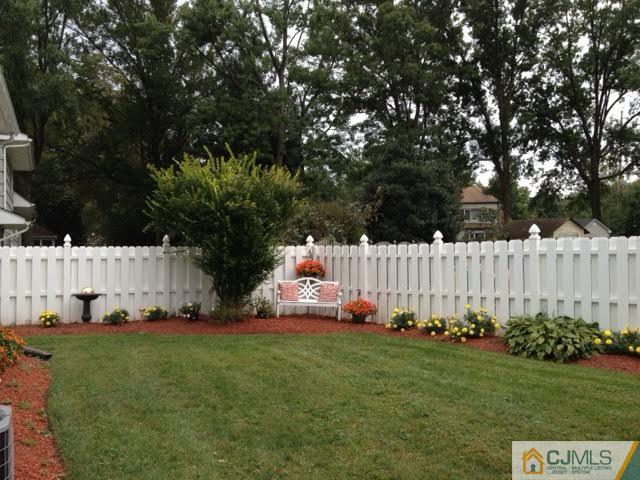 2 June Middlesex, NJ 08846 - Photo 22 of 23 a view of a house with a small yard and large trees