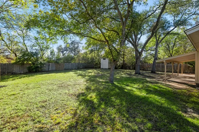 a backyard of a house with lots of green space