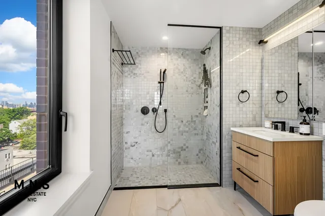 a bedroom with a large bed and a large window