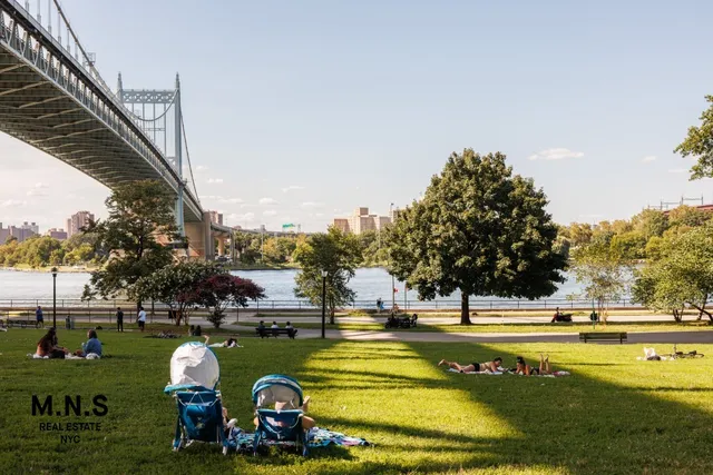 a group of people standing in a yard with swimming pool