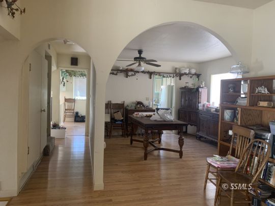 1221 North Garth Street Ridgecrest, CA 93555 - Photo 6 of 29 a view of a dining room with furniture and wooden floor