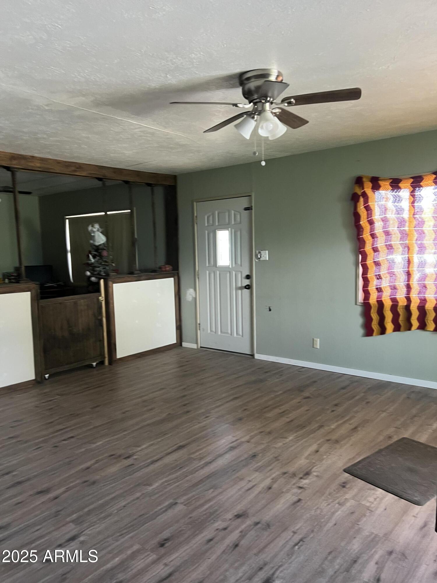 566 Carico Street Globe, AZ 85501 - Photo 12 of 22 a view of a livingroom with a staircase