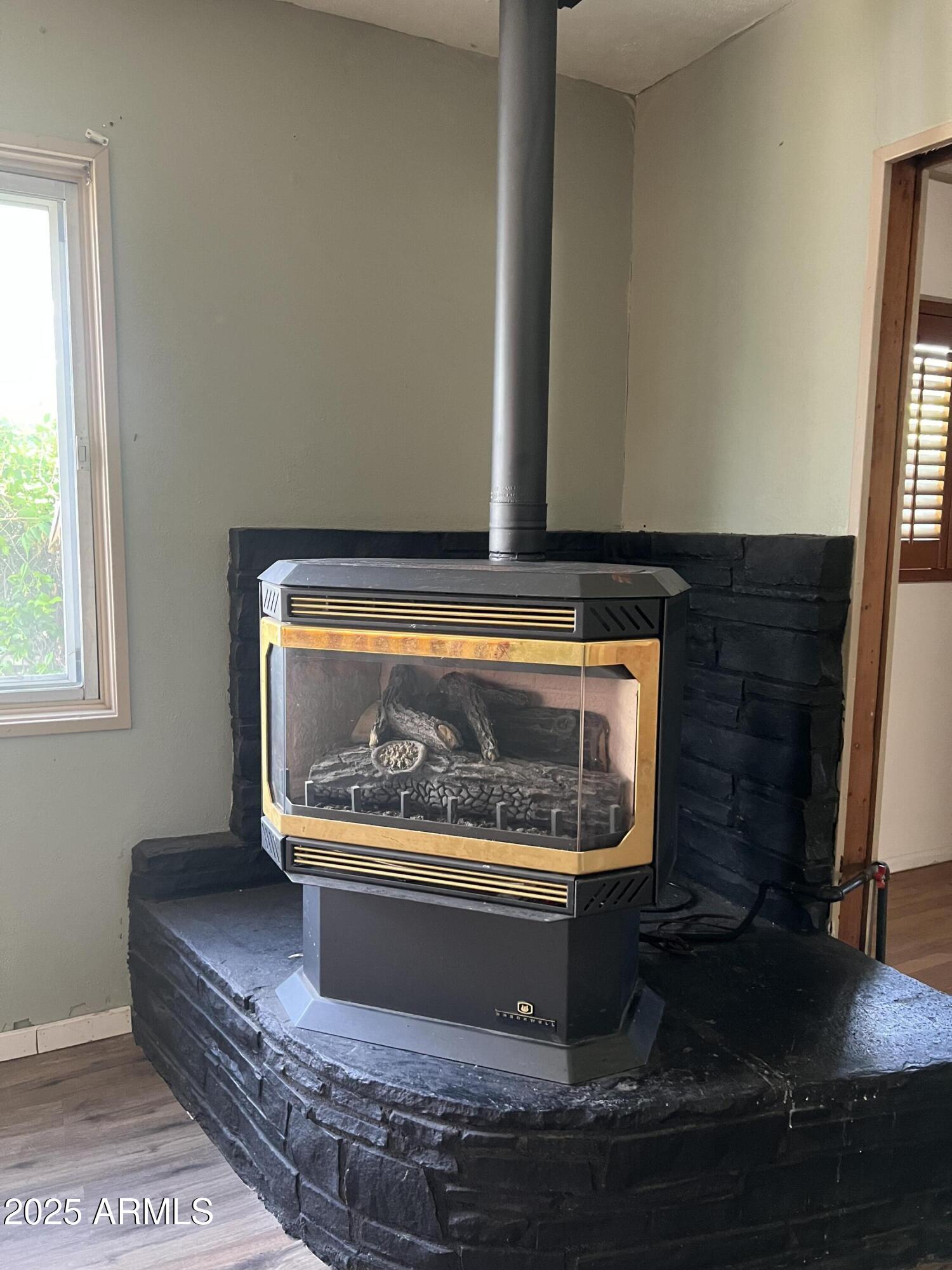 566 Carico Street Globe, AZ 85501 - Photo 14 of 22 a living room with a fireplace