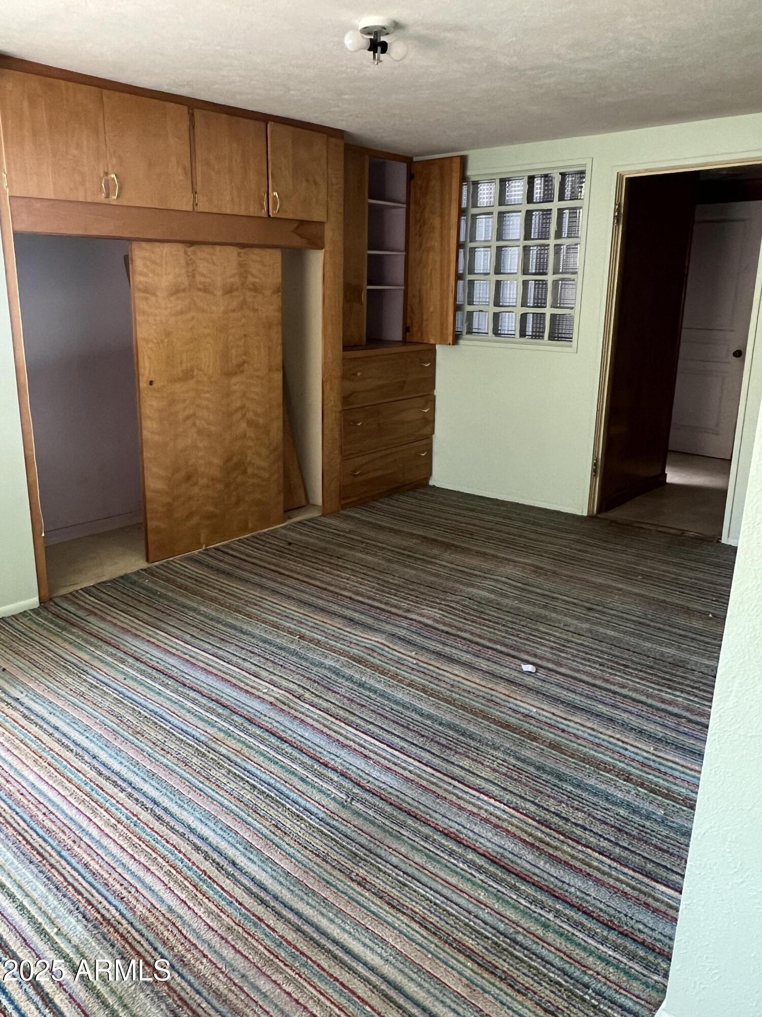 566 Carico Street Globe, AZ 85501 - Photo 18 of 22 a view of an empty room with a bathroom