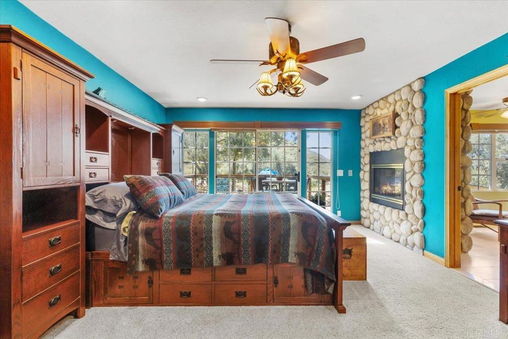 10499 Highway 79 Descanso, CA 91916 - Photo 18 of 75 a bedroom with furniture and large window