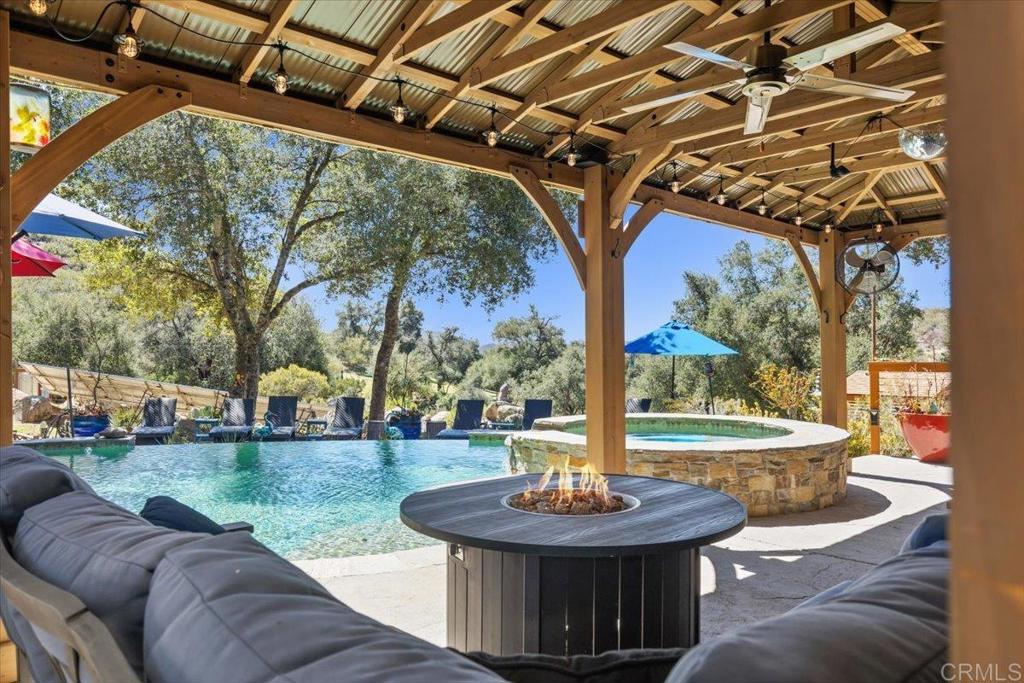 10499 Highway 79 Descanso, CA 91916 - Photo 2 of 75 a view of a couches in the deck under a large tree